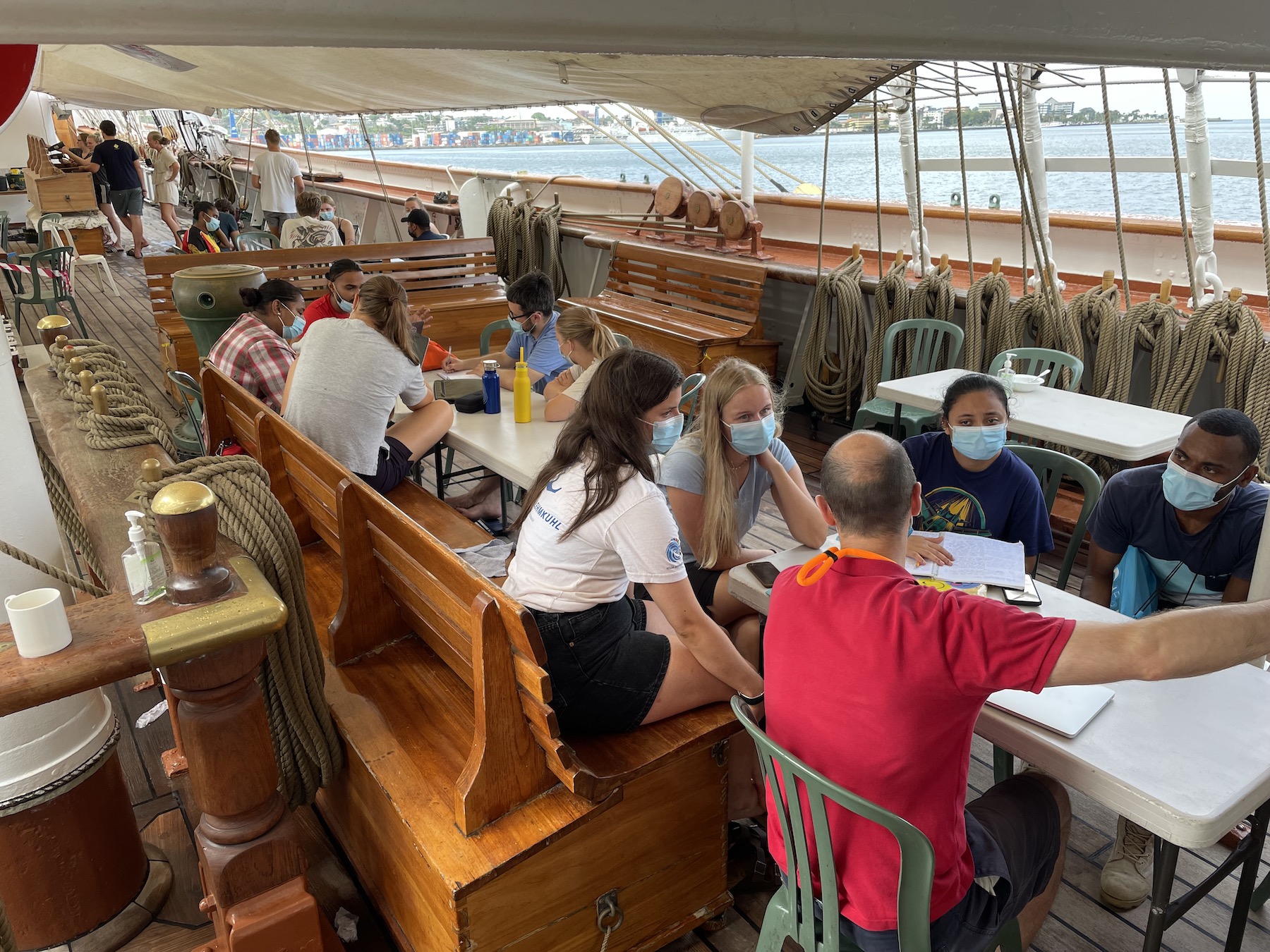 Group work on deck under the sun sail (Photo: Torunn Sandven Sagen). 
